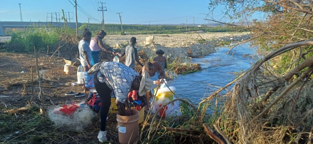 Trelawny residents join long queues to fetch river water after Hurricane Melissa