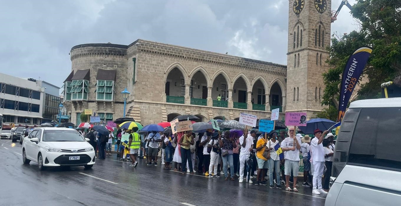 Marchers rally in support of broadcaster Ronnie Clarke