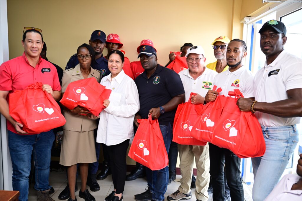 Custos of Clarendon hands over prefabricated houses to two families in St Elizabeth