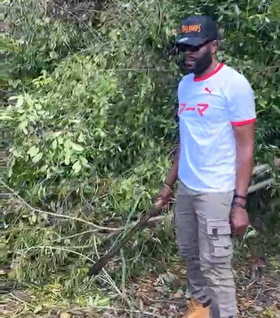 Bolt’s manager helps to clear road, assesses hurricane damage in legend’s hometown