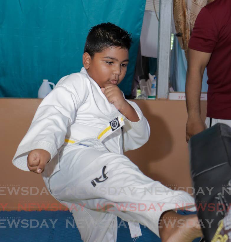 Nathan the little warrior in the water, on the mat