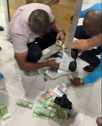 Police search Mohameds former business headquarters; seize cash, boxes of documents