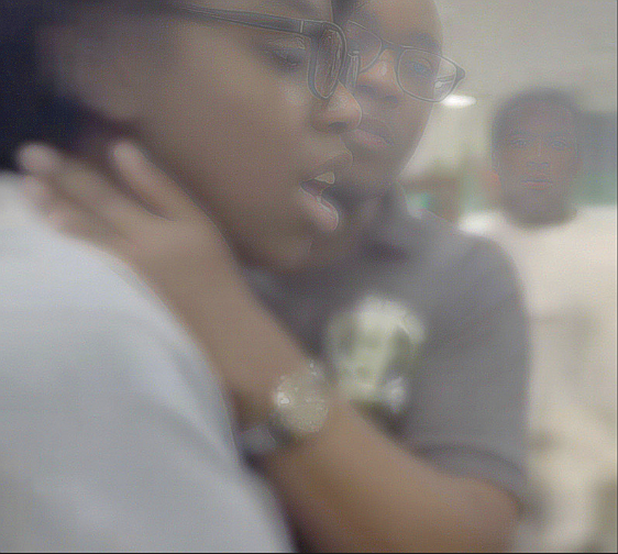 Video appears to show St John’s College principal with hands around girl’s neck