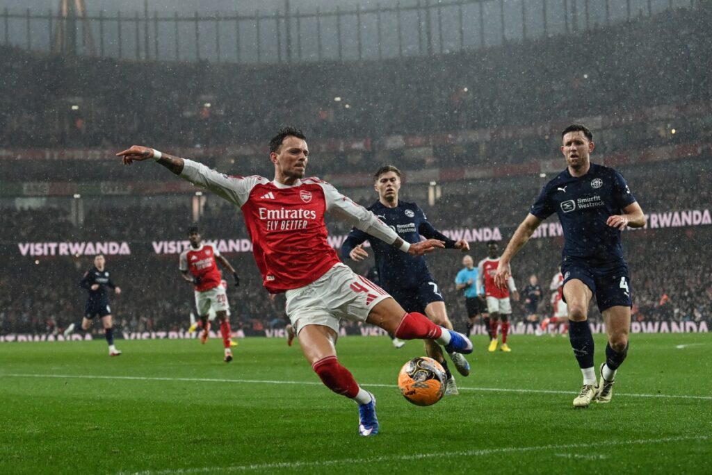 Quadruple chasing Arsenal rout Wigan to reach FA Cup fifth round