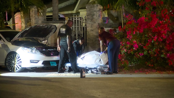 Man shot dead while working on car outside South Beach home