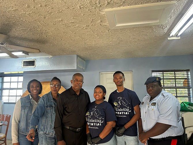 Junior Achievement group serves breakfast to Grand Bahama police