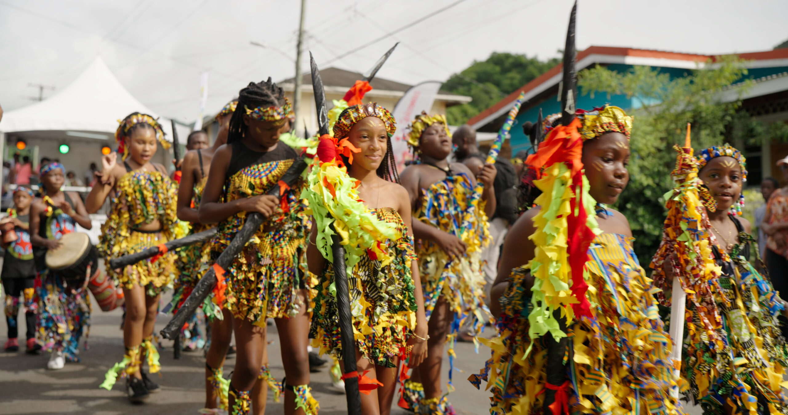 Senator Quinc Britton congratulates traditional mas bands